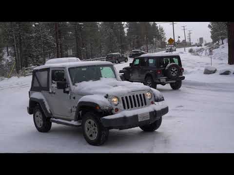 Cars sliding on Maple Lane after recent snowfall in Big Bear, CA