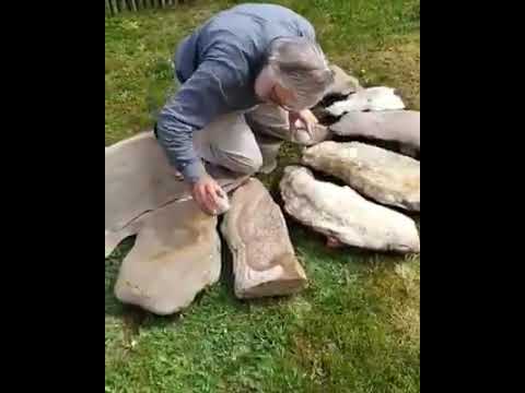 Archaeologist Dr. Jean-Loup Ringot specialized in prehistoric music demonstrates a Lithophone.