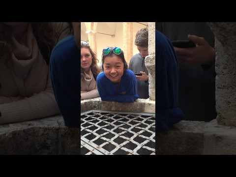 me singing into a well in italy